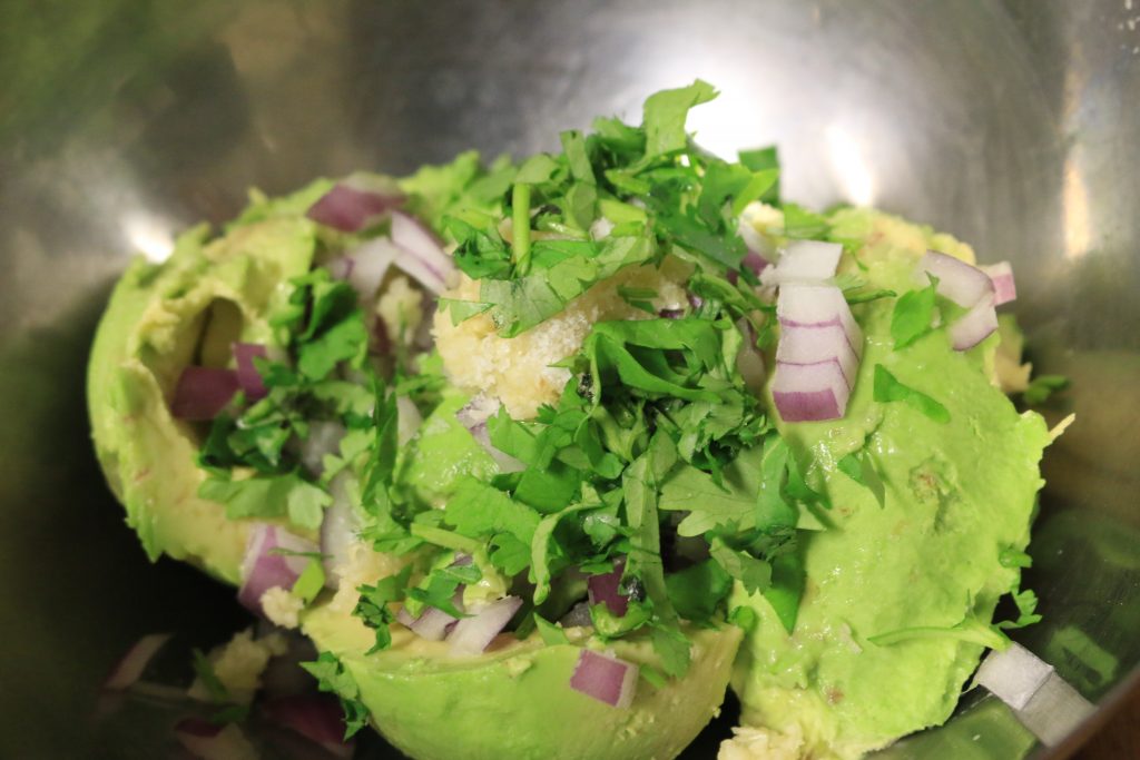 Scoop the avocado out of the skins and mash, add other ingredients and mix well