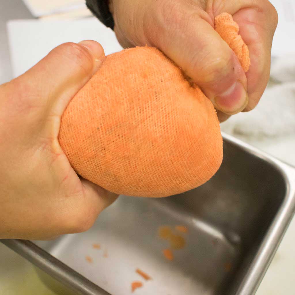Squeeze the grated potatoes in cloth
