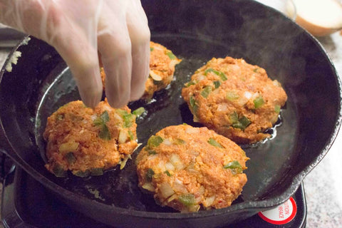 melt beef tallow in skillet then place the patties in the skillet