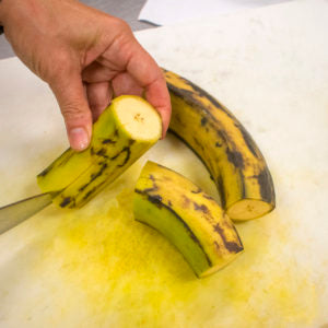 Cut the peels off the plantains and cut into chunks