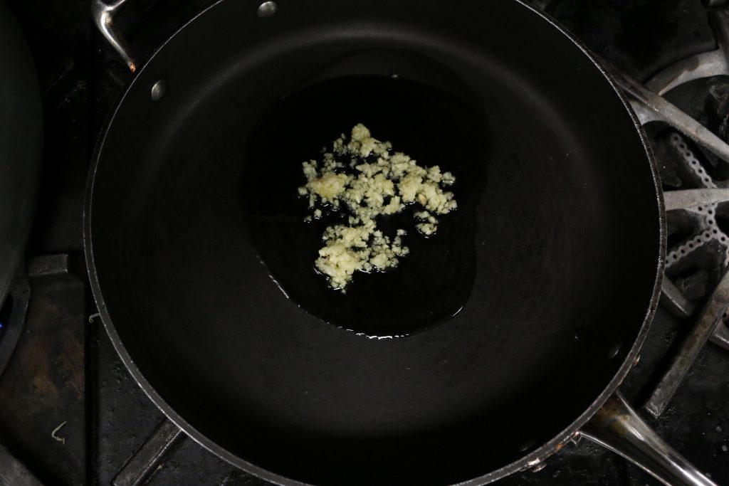 Heat olive oil and garlic in a saucepan