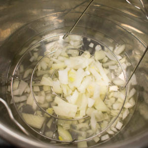 Add onions to the pressure cooker
