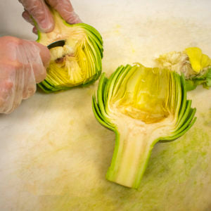 Grab the very inside leaves, and pull out, taking the choke with it