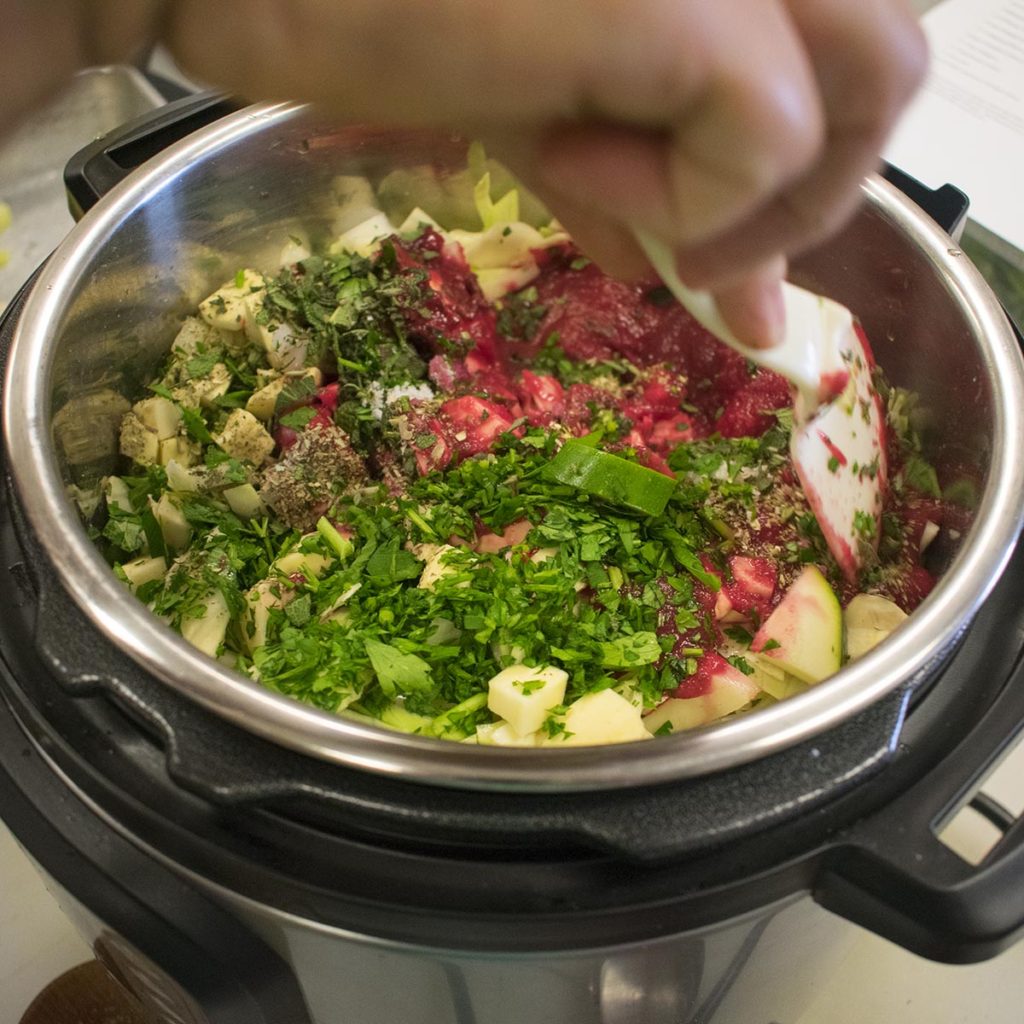 Stir in spinach and parsley and serve