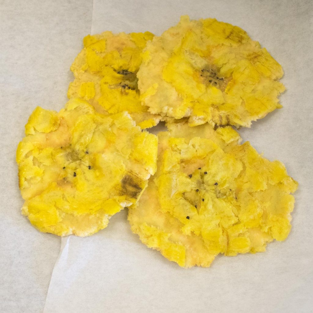 Reheat oil adding more if needed and fry the flattened disks for a second time until golden brown and crisp.