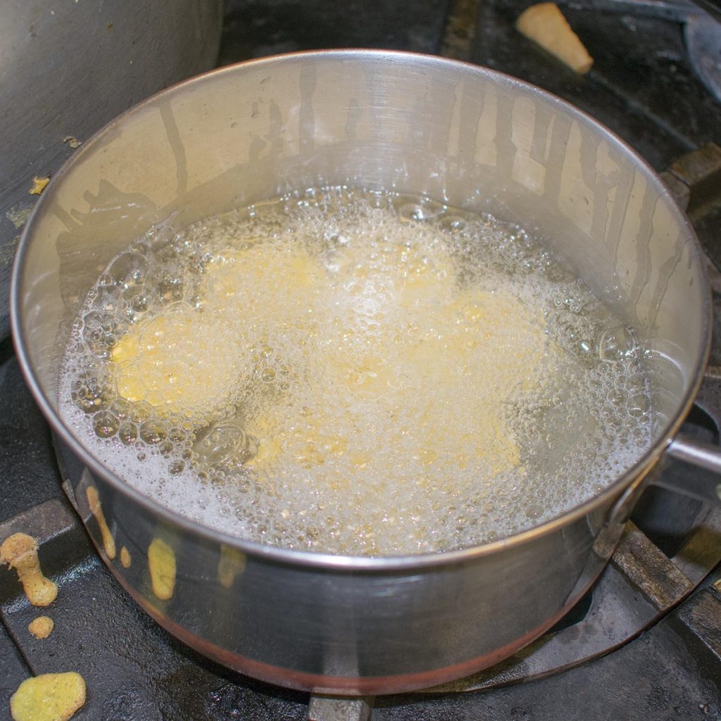 Heat the oil in a straight sided pan and when shimmering, add the plantain chunks. Fry 5-7 minutes
