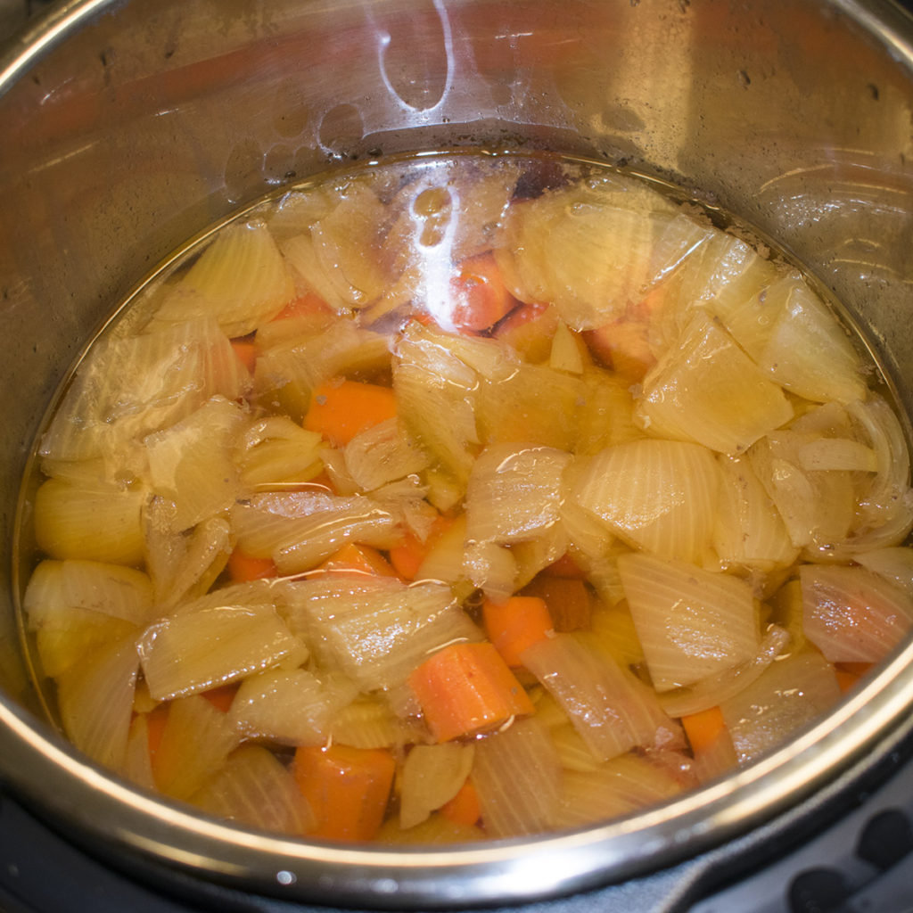 Pour in the water or broth
