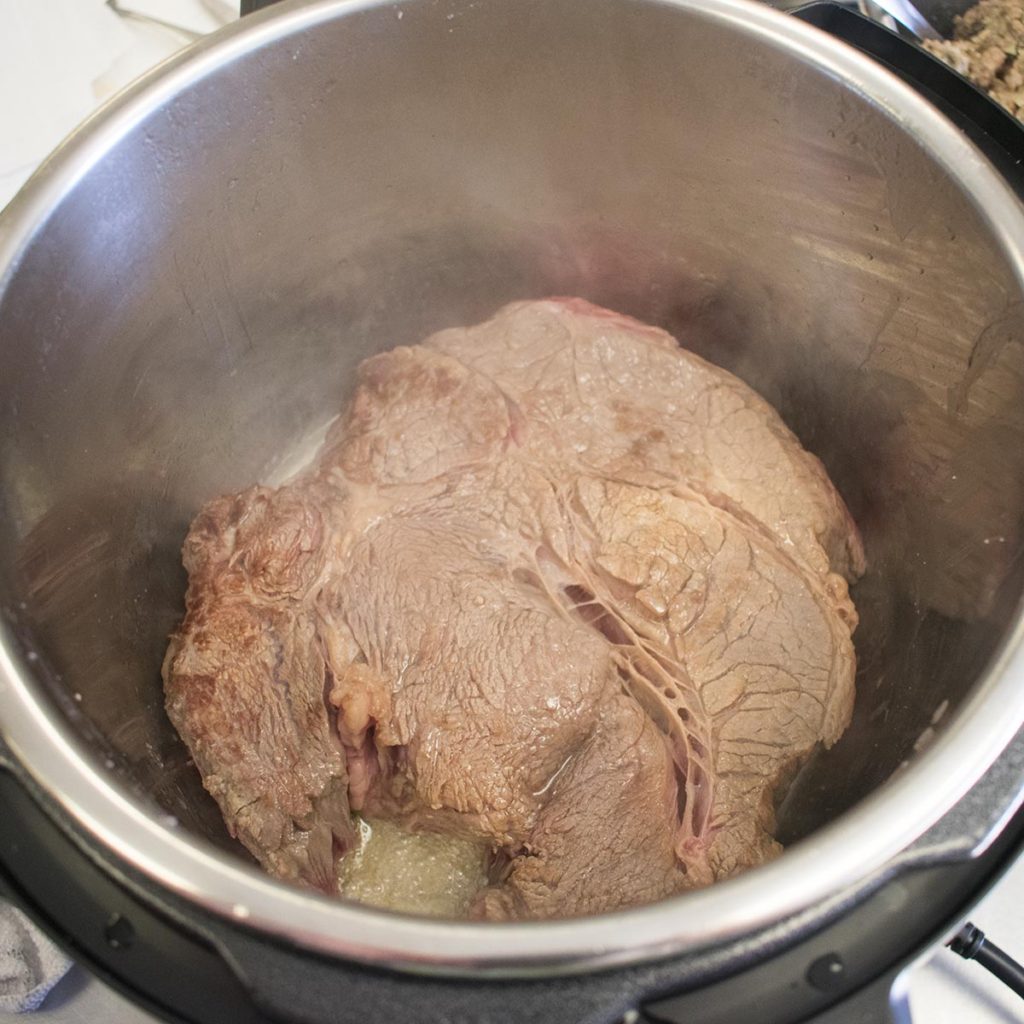 turn paleo pot roast to sear on other side for 2-3 minutes