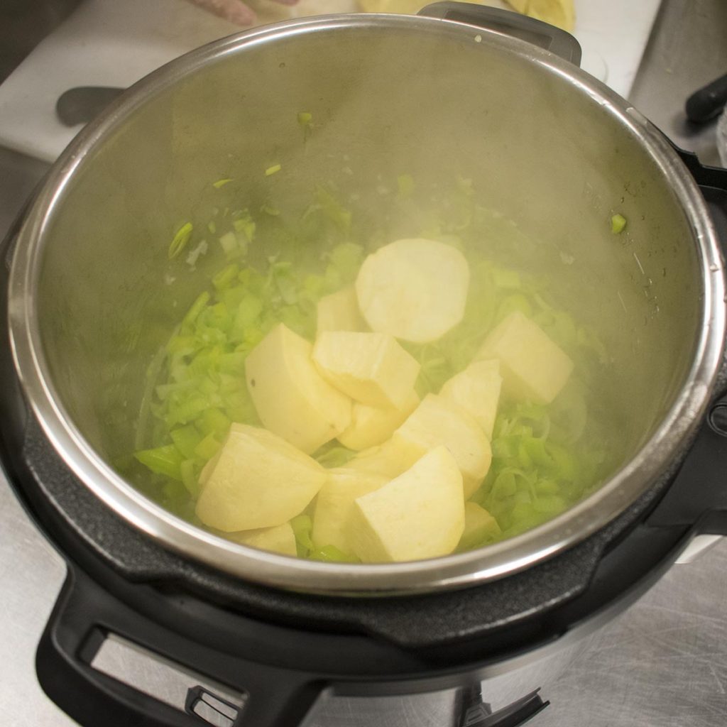 Add potatoes and broth, place the lid on and turn on pressure and cook for 25 minutes