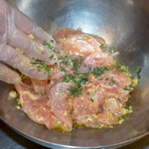 Add the Chicken, Oil, Italian seasoning, Salt and Garlic to a Mixing Bowl