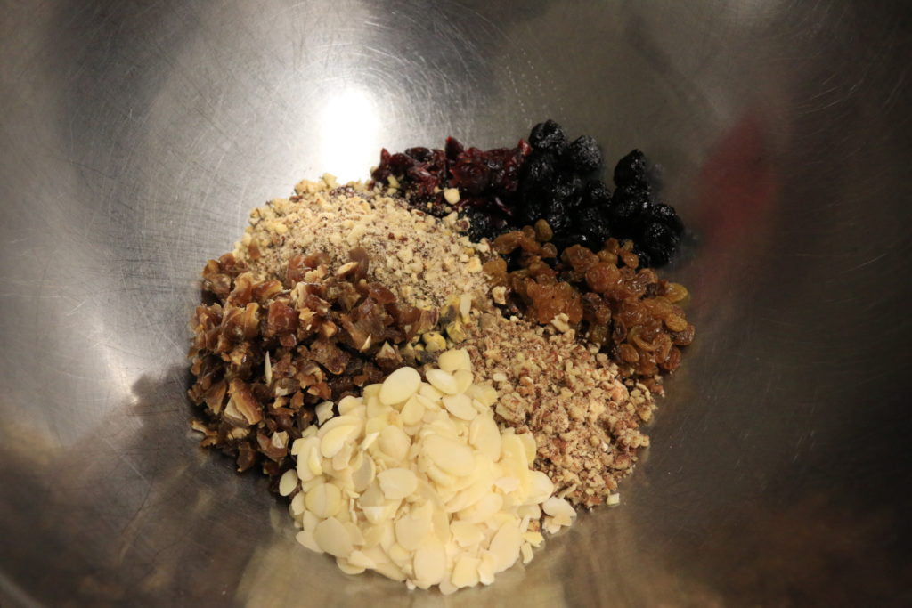 In a bowl, toss the dates with the cranberries, cherries and raisins