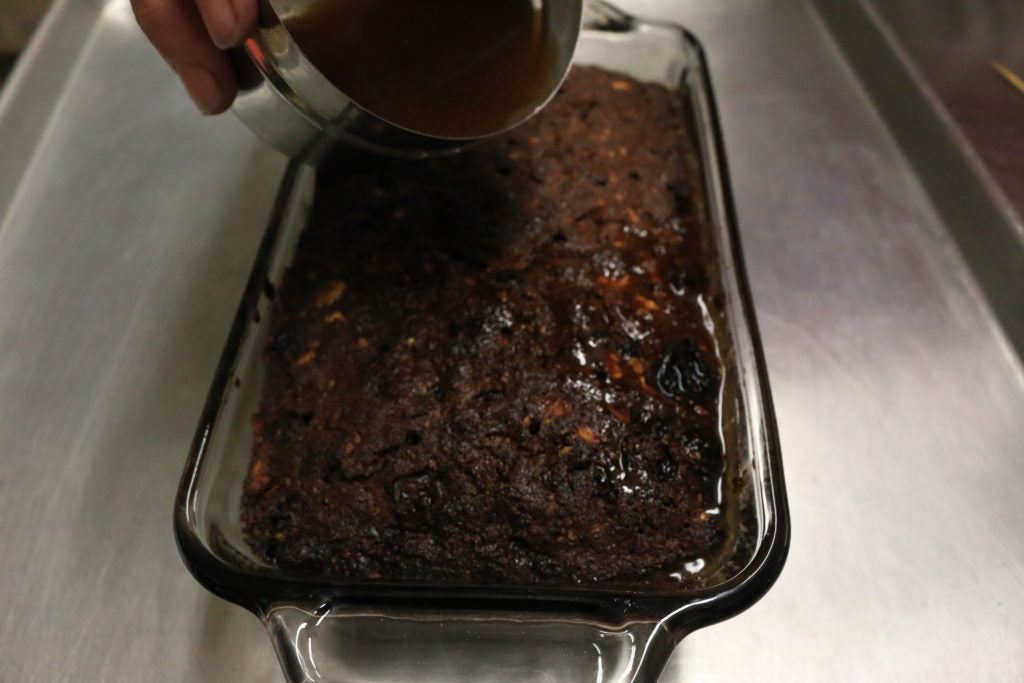 Pour the reduced bourbon over the warm cake as soon as it comes out of the oven