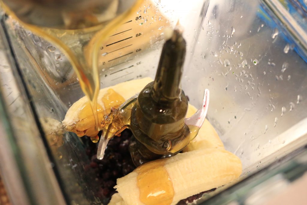 Pour honey into blender