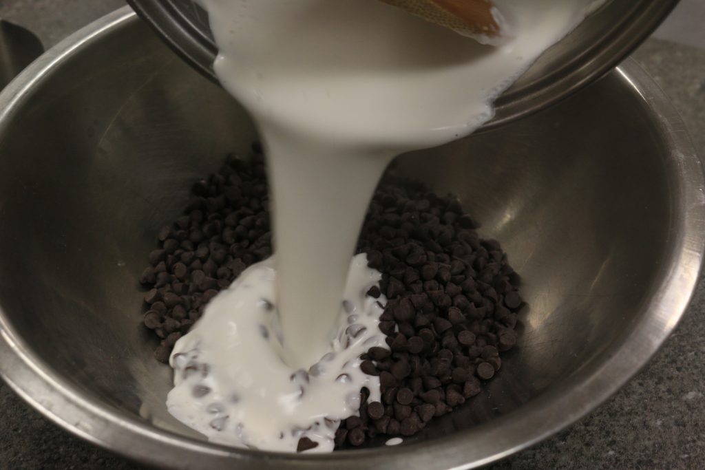pour hot cream over them over chocolate chips