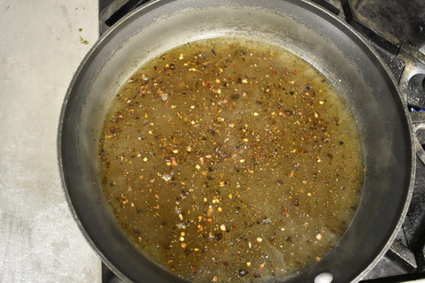 In the same pan, heat the remaining 1 tablespoon olive oil and add the remaining garlic, ginger and scallions