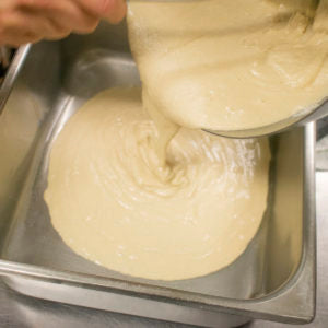 Pour the aip peach cobbler batter in a baking pan