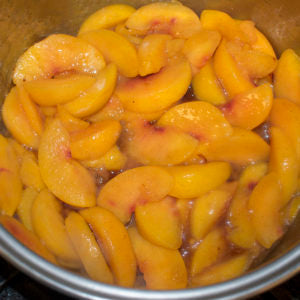 Add sliced peaches in a saucepan