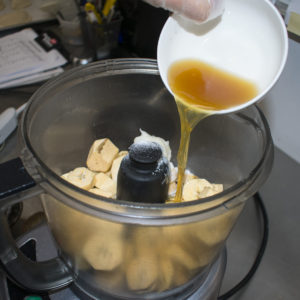Add bone broth to the food processor