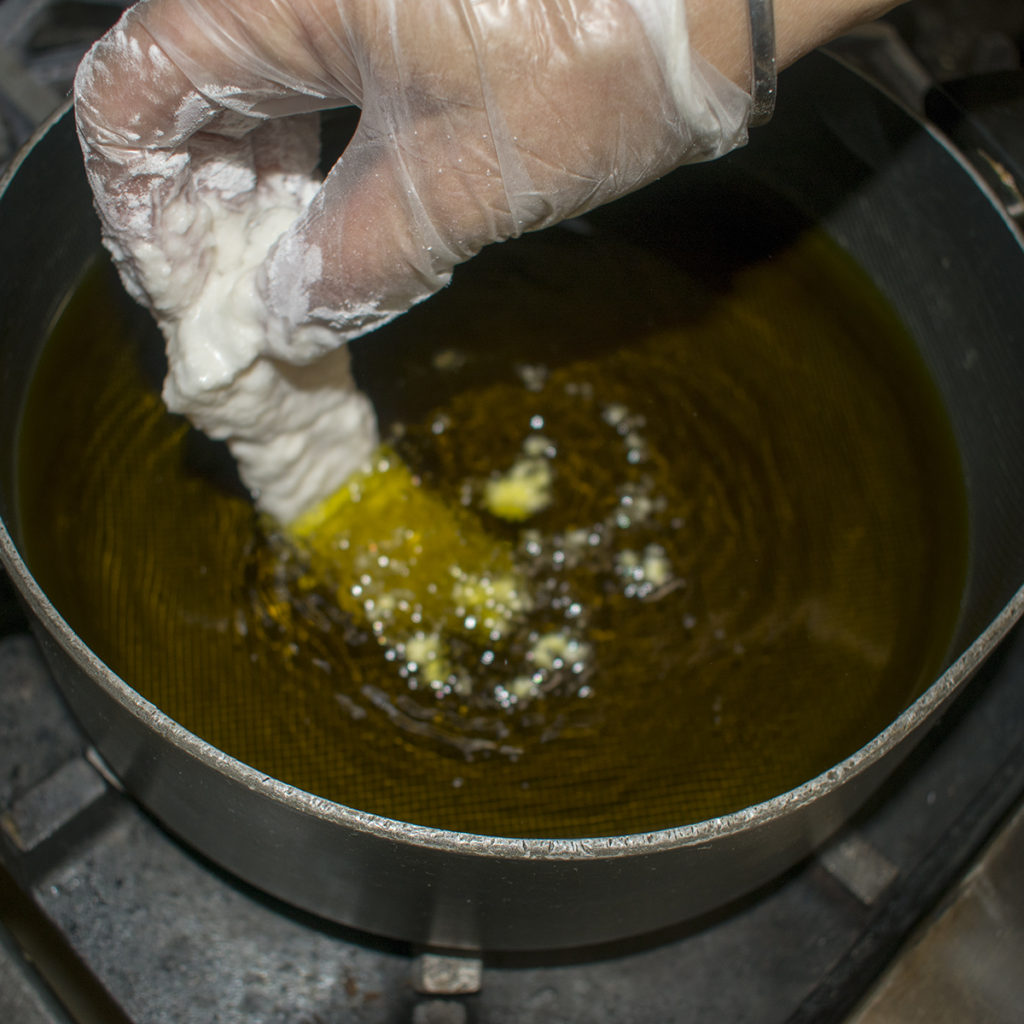 Gently place each piece of fish into the hot oil