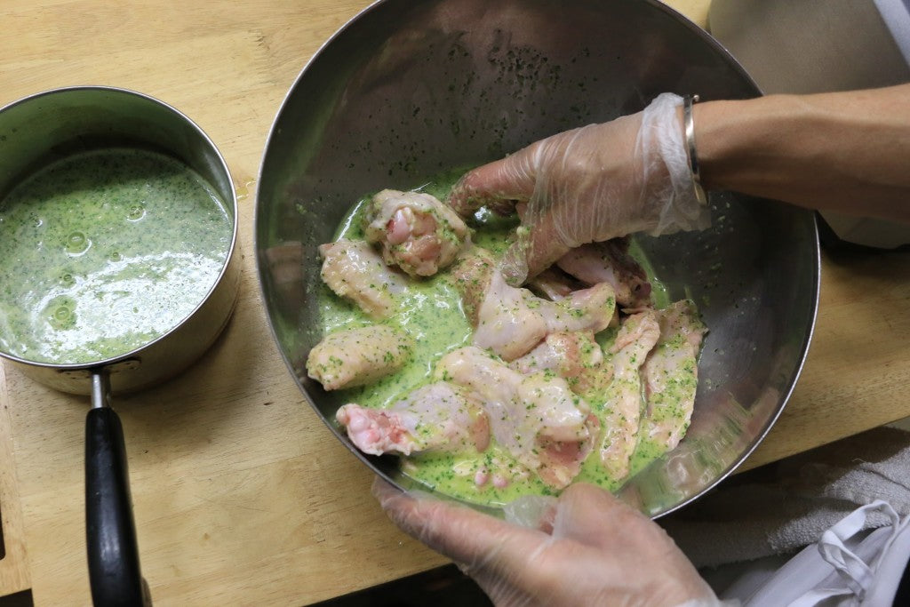 When wings are finished cooking, toss them in the reduced marinade for extra flavor