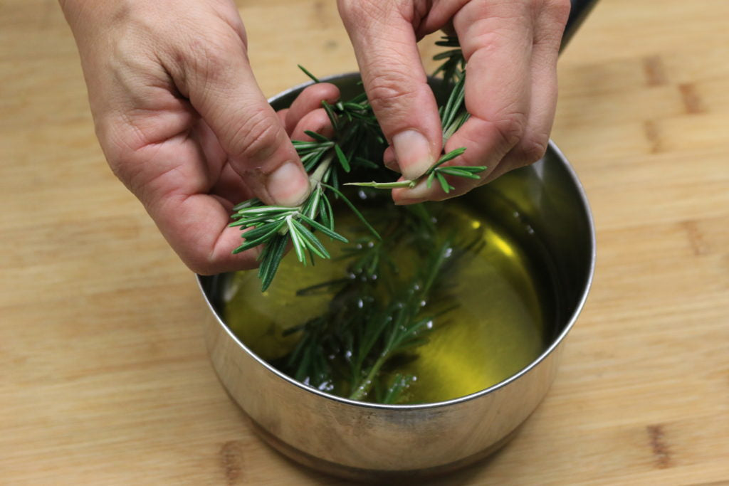 Add oil, steep rosemary and garlic