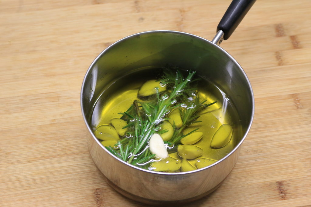 Heat rosemary garlic infused oil for a few minutes