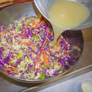 Whisk in oil to combine dressing