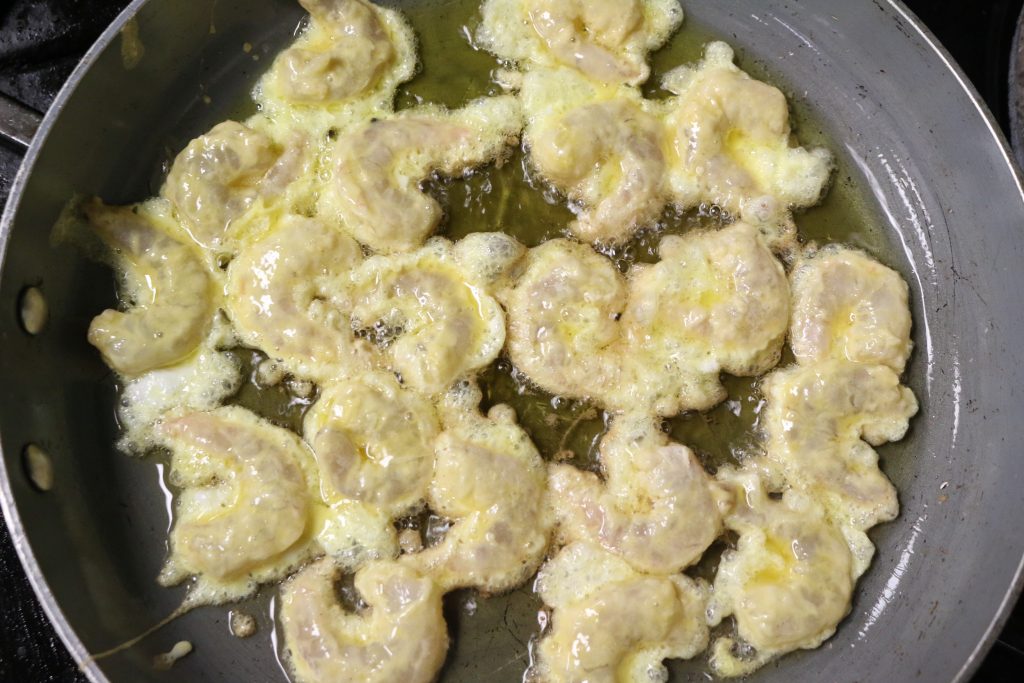 Cook shrimp in large skillet