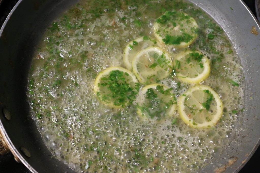 Remove from heat, add lemon slices and parsley