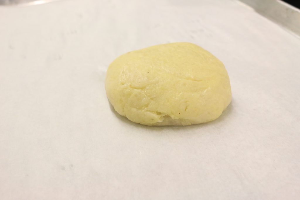 Form yucca dough into a neat round ball